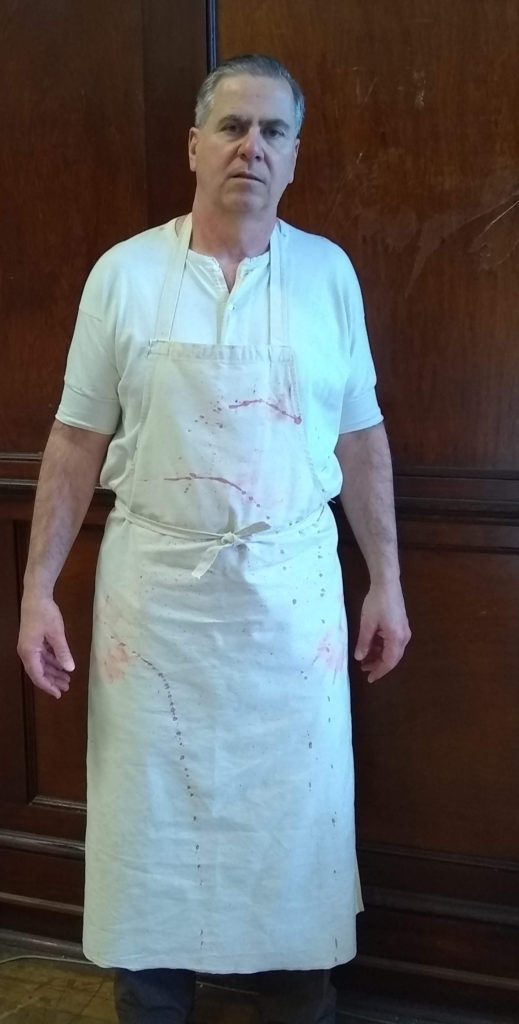 William Giaimo as a chicken butcher